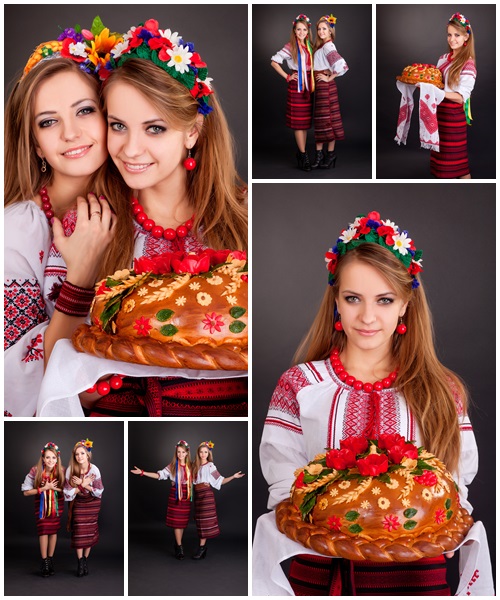 Beautiful women in ukrainian clothes - Stock Photo